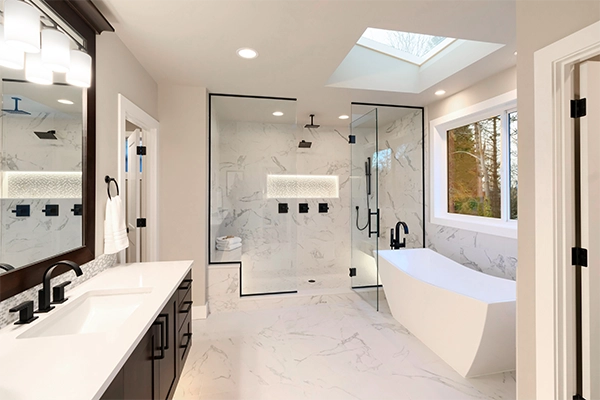 Tub To Shower Conversion and Walk-In Shower Remodel Modern tub-to-shower conversion with walk-in shower and freestanding tub in a luxury bathroom remodel