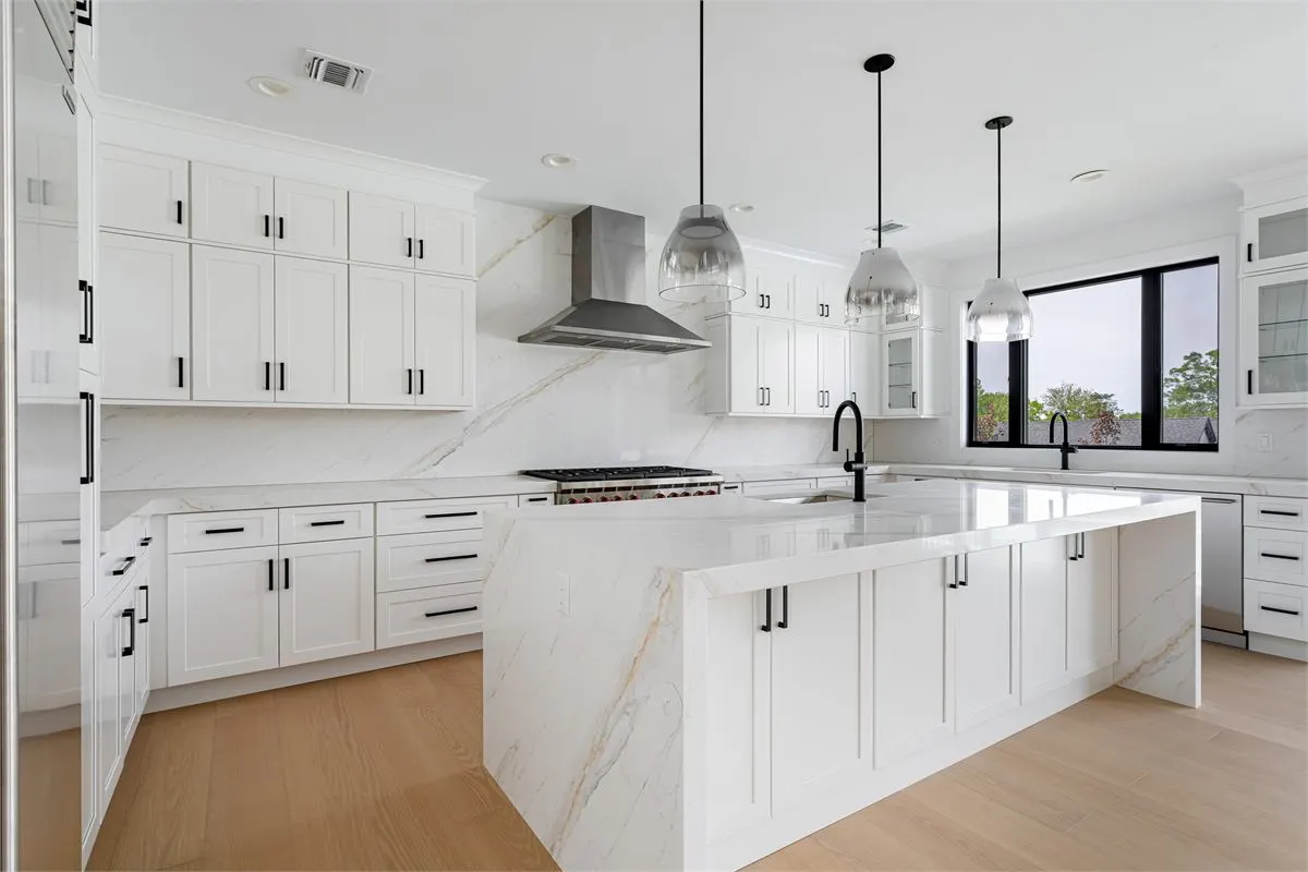 Full kitchen remodeling service with waterfall island and custom cabinetry
